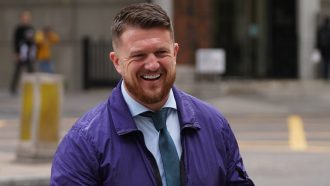 Tommy Robinson charged after attending antisemitism march in London